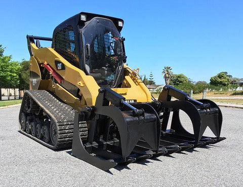 72" skid steer grapple bucket front view
84" rock grapple on skid steer in action
Close-up of dual hydraulic cylinder and hose setup
Heavy-duty tines and steel frame
Grapple holding large rocks and debris