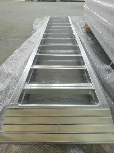 10-foot aluminum loading ramps placed on utility trailer
Heavy-duty HDR300 loading ramps close-up with grip detail
Side view of aluminum ramp showing gradual incline
Vehicle approaching wide aluminum loading ramps
Industrial pair of loading ramps for heavy machinery