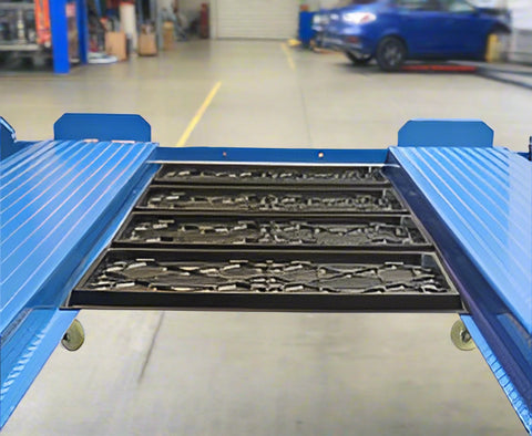 Blue portable 4-post car hoist in garage
Drive-on ramp and runway surface
Close-up of power unit and lift columns
Vehicle elevated on blue car lift
Heavy-duty safety locks and cable system