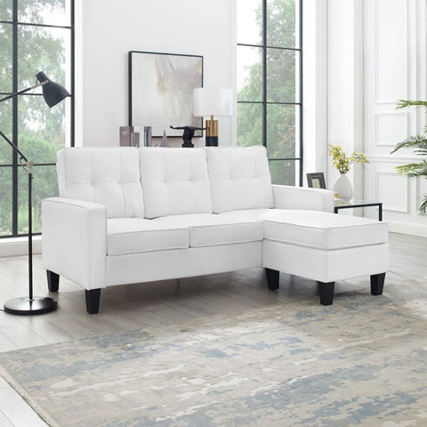 Reversible black sectional sofa in small apartment
Brown 3-seater L-shaped couch in modern room
White PU leather couch with chaise on right
Compact living room with small space sectional