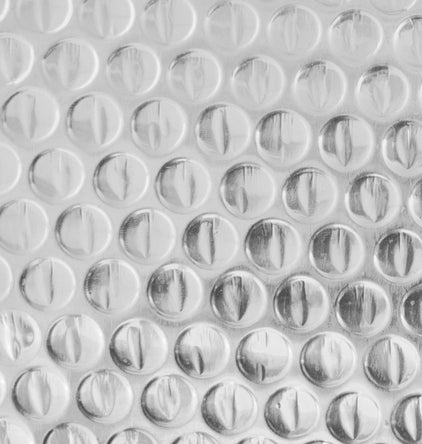 Roll of Reflective Foil Bubble Insulation β 4 FT x 25 FT
Close-up of Bubble Film Core Laminated with Foil Layers
Cross-Section of Reflective Insulation Showing 2-Layer Foil
Foil Bubble Roll Partially Unrolled for Indoor Gardening