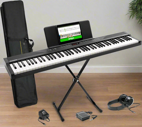 Alesis Recital Play digital piano with accessories bundle
88-key digital piano with stand and gig bag
USB MIDI piano setup for students and beginners
Full view of Alesis Recital Play with pedal and stand
Piano demo showing voices, rhythms, and modes