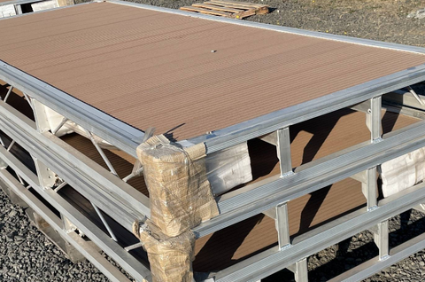 Complete aluminum dock system with wood grain vinyl decking
4x10 FT aluminum dock section by water
Aluminum dock kit with base plates and auger ends
Lakefront dock system installation with ramp connector