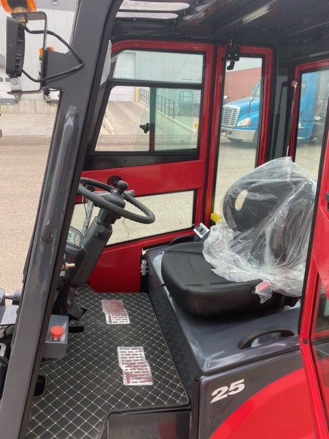 CanLift 5,500 lb electric forklift front side view
Side profile of electric forklift with red cabin
CanLift warehouse forklift with 4-foot lift
Battery-powered forklift in industrial setting
Forklift with cabin and side shift attachment