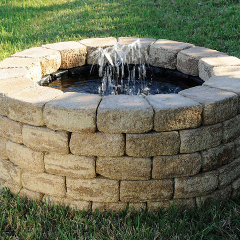 Completed Backyard Pond – Liner Covered with Stones