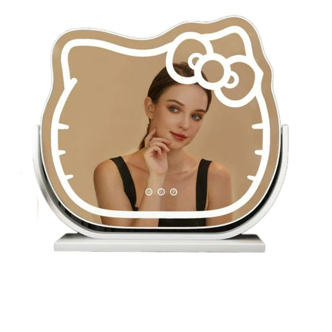 Hello Kitty LED lighted vanity mirror – front view
Oval-shaped pink and white cosmetic mirror on vanity
Mirror lit in 3 different LED color settings
Close-up of Hello Kitty bow design
Free-standing mirror on dressing table