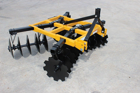 8 ft yellow 3-point tractor disc harrow with notched blades/
Close-up of notched disc blades, double taper bearing system