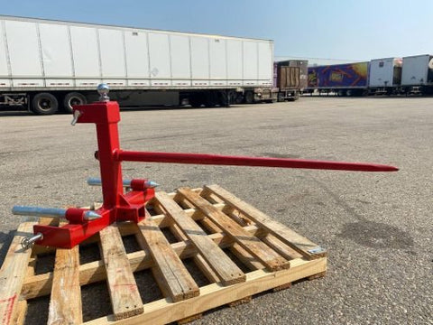 Red 3-point gooseneck hitch with bale spear mount
Tractor trailer hitch attachment with hay spear slots
Reinforced hitch frame for Conus 2 and Conus 1 spear placement
3-point trailer hitch attachment mounted on tractor
Spear holes and 2” trailer receiver on attachment frame