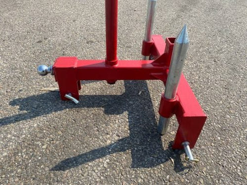 Red 3-point gooseneck hitch with bale spear mount
Tractor trailer hitch attachment with hay spear slots
Reinforced hitch frame for Conus 2 and Conus 1 spear placement
3-point trailer hitch attachment mounted on tractor
Spear holes and 2” trailer receiver on attachment frame