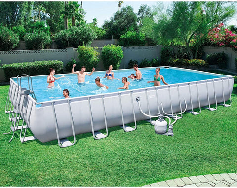Family enjoying 31ft steel frame above ground swimming pool