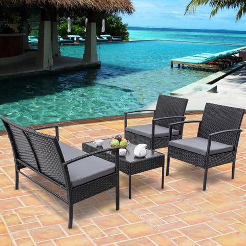 Black rattan outdoor furniture set with loveseat and chairs
4-piece outdoor patio set with glass coffee table on patio
Weather-resistant black PE rattan seating with cushions
Loveseat and two single chairs outdoor set with glass table