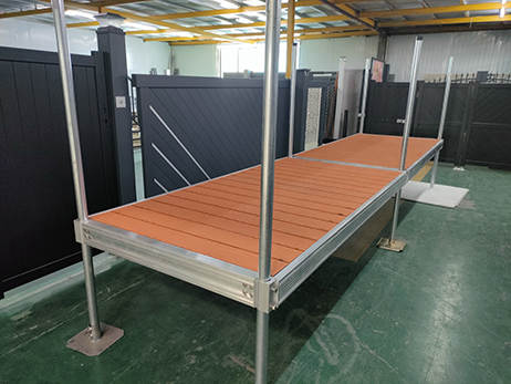 Complete aluminum dock system with wood grain vinyl decking
4x10 FT aluminum dock section by water
Aluminum dock kit with base plates and auger ends
Lakefront dock system installation with ramp connector