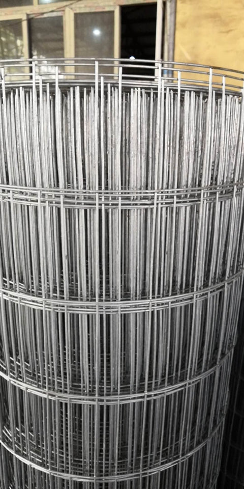 Roll of 5x100 ft wire mesh fencing
Fence label: "No-Climb Wire Mesh – Light Duty"
Close-up of 2"x4" galvanized mesh