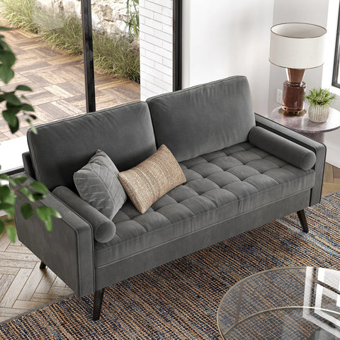 69.7-inch modern velvet sofa in navy blue with tufted back
Gray velvet upholstered sofa with pillows
Side view of modern green couch with wooden legs
Mid-century couch with tufted back and square arms