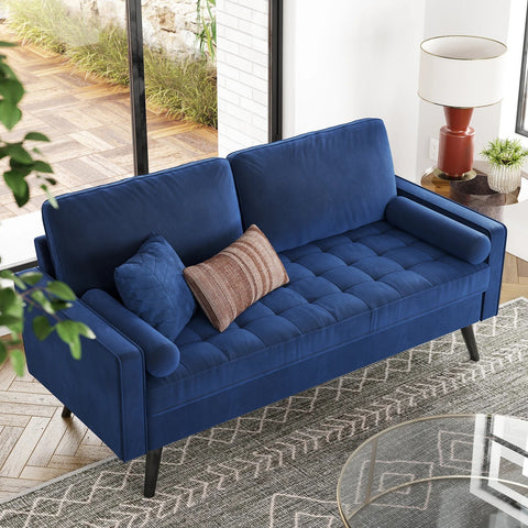 69.7-inch modern velvet sofa in navy blue with tufted back
Gray velvet upholstered sofa with pillows
Side view of modern green couch with wooden legs
Mid-century couch with tufted back and square arms
