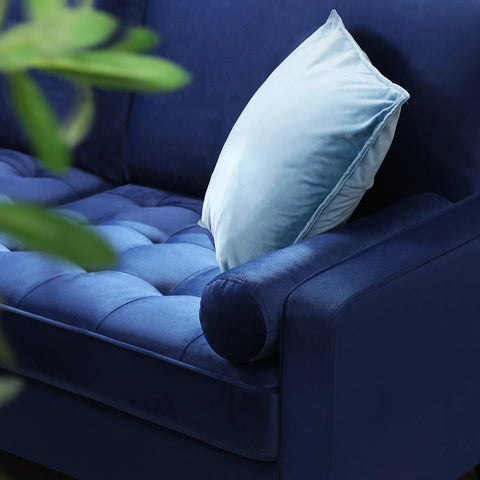 69.7-inch modern velvet sofa in navy blue with tufted back
Gray velvet upholstered sofa with pillows
Side view of modern green couch with wooden legs
Mid-century couch with tufted back and square arms
