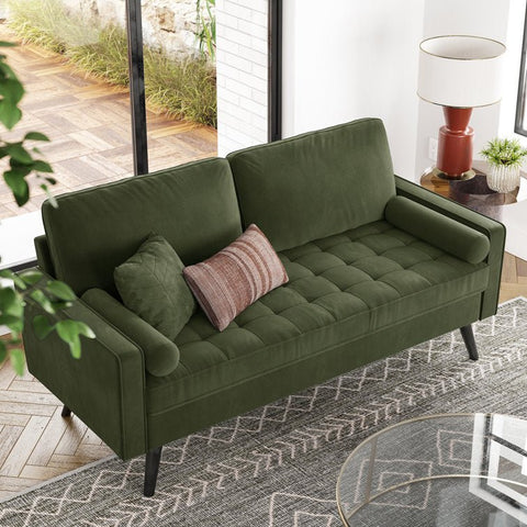69.7-inch modern velvet sofa in navy blue with tufted back
Gray velvet upholstered sofa with pillows
Side view of modern green couch with wooden legs
Mid-century couch with tufted back and square arms
