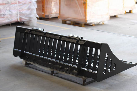 Heavy-duty skid steer skeleton rock bucket β front angled view
Close-up of reinforced steel tines and grapple mounts
84β rock bucket on skid steer in yard cleanup
Side view of skeleton-style skid loader bucket
Multiple bucket sizes displayed on gravel lot