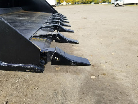 80" skid steer digging bucket with removable teeth
Heavy-duty bucket on job site with loader
Front view of 84-inch skid steer bucket
Skid steer digging into dirt with steel bucket
Wear strips and teeth close-up for material handling