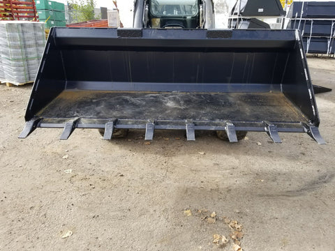 80" skid steer digging bucket with removable teeth
Heavy-duty bucket on job site with loader
Front view of 84-inch skid steer bucket
Skid steer digging into dirt with steel bucket
Wear strips and teeth close-up for material handling
