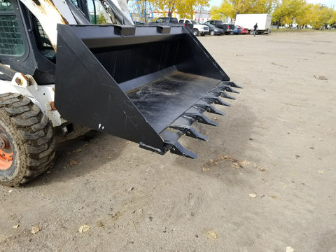 80" skid steer digging bucket with removable teeth
Heavy-duty bucket on job site with loader
Front view of 84-inch skid steer bucket
Skid steer digging into dirt with steel bucket
Wear strips and teeth close-up for material handling