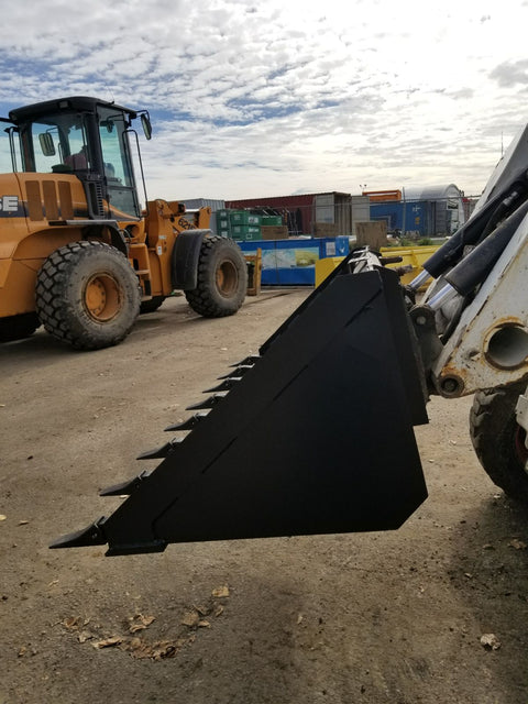 80" skid steer digging bucket with removable teeth
Heavy-duty bucket on job site with loader
Front view of 84-inch skid steer bucket
Skid steer digging into dirt with steel bucket
Wear strips and teeth close-up for material handling