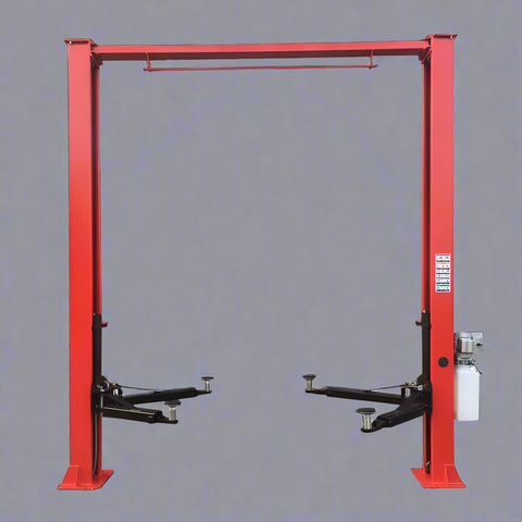 Red 2-post car hoist installed in garage
Close-up of safety lock and lift arms
Base of the lift showing manual release system
Top bar and symmetrical arm configuration