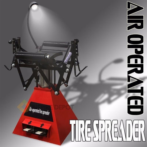 Air-operated tire spreader machine for 15 inch tires with red frame”
Pneumatic tire spreader with foot pedal control for repair shops
Heavy-duty tire spreader with flex-arm light for patch and buff work