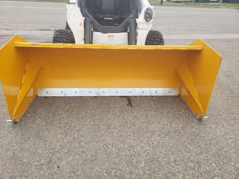 Bendall skid steer snow pusher attached to loader
Yellow snow box blade for skid steer
Heavy-duty snow bucket blade in winter setting
96-inch Bendall box blade in commercial snow use
Rear angle of Bendall snow blade showing mold board