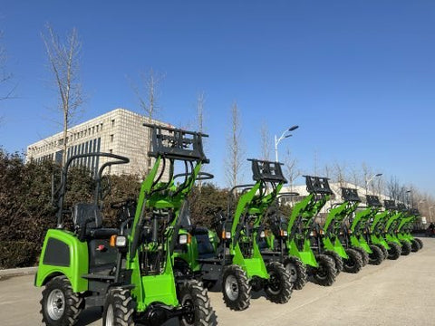 CanLift Lithium Electric Wheel Loader – Front View with Bucket
Green eco-friendly CanLift wheel loader on grass lot with trailer