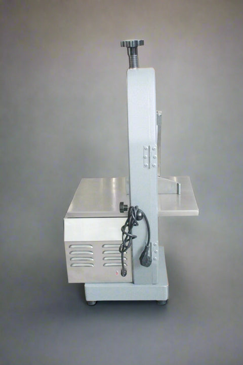 Main view of stainless steel meat and bone cutting saw machine
Compact commercial meat saw for kitchen or butcher use
Electric bone saw with sliding tray and safety guard
Replacement blade for commercial bone saw machine
Close-up of saw handle and stainless construction
