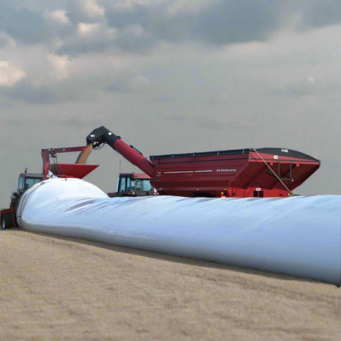 10 ft x 300 ft heavy duty grain bag filled with corn on a farm field
Polyethylene grain bag used for temporary harvest storage
Farm equipment loading grain into a 10 mil white grain bag
UV-protected 10 mil grain storage bag on rural property
