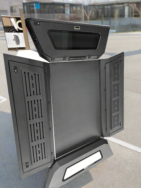 Side view of heavy-duty steel truck topper on black pickup
Modular canopy with open gullwing side door
Lockable utility cap rear view
Installation components of modular truck canopy
Steel topper installed on full-size pickup truck