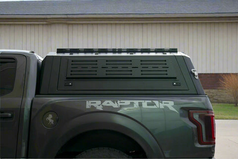 Side view of heavy-duty steel truck topper on black pickup
Modular canopy with open gullwing side door
Lockable utility cap rear view
Installation components of modular truck canopy
Steel topper installed on full-size pickup truck