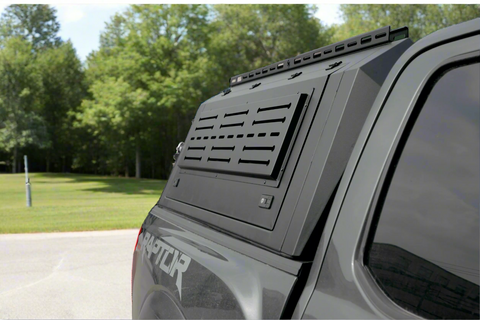 Side view of heavy-duty steel truck topper on black pickup
Modular canopy with open gullwing side door
Lockable utility cap rear view
Installation components of modular truck canopy
Steel topper installed on full-size pickup truck