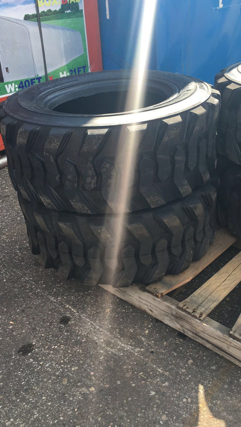 “Heavy duty skid steer tires with aggressive tread”
“SKS-1 and SKS-4 tires for Bobcat A300 and S750”
“Skid steer tires with red and silver rims”
“10x16.5 to 15x19.5 skid steer tire variants”
“Close-up of durable construction skid steer tire”