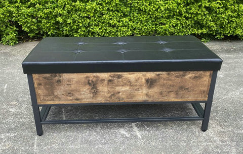 "Industrial Chesterfield-style storage bench ottoman with black metal frame, faux leather tufted top, and hidden trunk storage – Model TSLB2110"