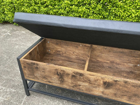 "Industrial Chesterfield-style storage bench ottoman with black metal frame, faux leather tufted top, and hidden trunk storage – Model TSLB2110"