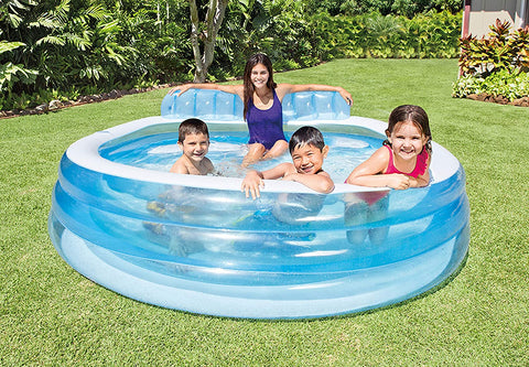 Intex Swim Center Family Lounge Pool with kids
Top view of inflatable lounge pool with bench
Inflatable family pool with built-in seat and backrest
Parents and kids relaxing in backyard pool
Blue vinyl family-size lounge pool filled with water