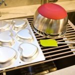 Large gray over-the-sink roll-up dish drying rack with stainless steel rods for multipurpose kitchen use – heat-resistant BPA-free silicone design