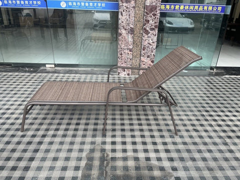 Reclining folding patio lounger chair on the beach
Adjustable sun lounger with breathable Teslin mesh
Close-up of outdoor lounger armrest and frame
Folded outdoor lounge chair ready for storage
Lounger chair beside swimming pool deck