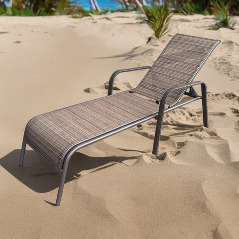 Reclining folding patio lounger chair on the beach
Adjustable sun lounger with breathable Teslin mesh
Close-up of outdoor lounger armrest and frame
Folded outdoor lounge chair ready for storage
Lounger chair beside swimming pool deck