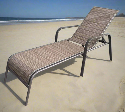 Reclining folding patio lounger chair on the beach
Adjustable sun lounger with breathable Teslin mesh
Close-up of outdoor lounger armrest and frame
Folded outdoor lounge chair ready for storage
Lounger chair beside swimming pool deck