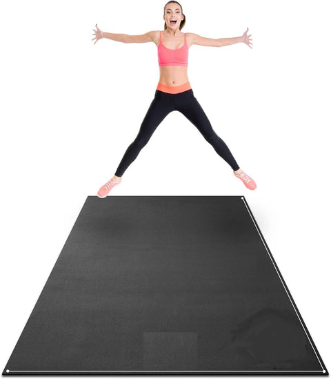 woman exercising on black non-slip fitness mat at home
large gorilla mat for home gym with yoga straps
extra thick workout mat for HIIT and cardio training
folded 7mm thick gym mat with carry handle
yoga and strength training on extra-large exercise mat