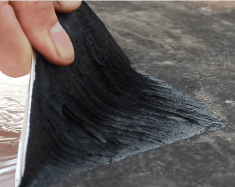 Self-adhesive asphalt patch tape unrolled for roof repair
Waterproof crack repair tape applied on concrete surface
Close-up of 2mm thick asphalt tape texture
DIY roof sealing with black asphalt repair tape
Roll of outdoor waterproof sealing tape on workbench