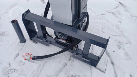 CPD1284H Skid Steer Post Driver mounted on skid steer
Side view of Quick Sledge hydraulic post driver on worksite
Self-contained fence post driver close-up with universal mount
Post driver driving steel post into ground on rocky terrain
Compact skid steer post driver for fencing and landscaping