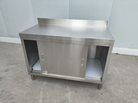 Stainless steel workbench with sliding doors front view
Restaurant prep table with built-in storage
Commercial kitchen stainless steel workbench
Side view of sliding door stainless work table
Heavy-duty garage workbench with stainless cabinet