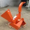 Front view of BX42T 3-point wood chipper attachment
Side profile showing 25" chipping disk on BX42T
Close-up of chipper blades and discharge chute
BX42T wood chipper connected to tractor PTO