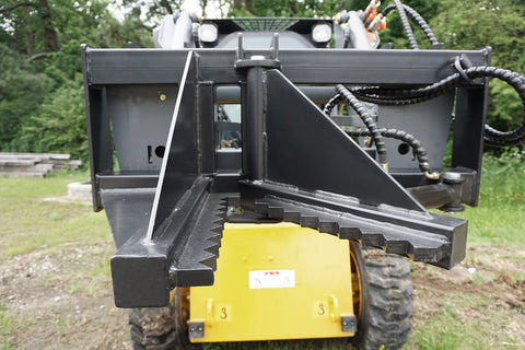 Tree and fence post puller attached to a skid steer
Side view of post puller showing steel jaws and hydraulic cylinder
Top-down view of post puller with open clamp
Puller in action removing small tree from ground
Compact and rugged post puller for skid steer