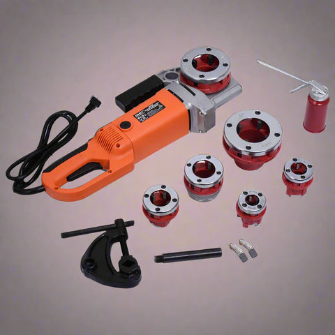 Close-up of portable pipe threading machine and dies for steel plumbing work